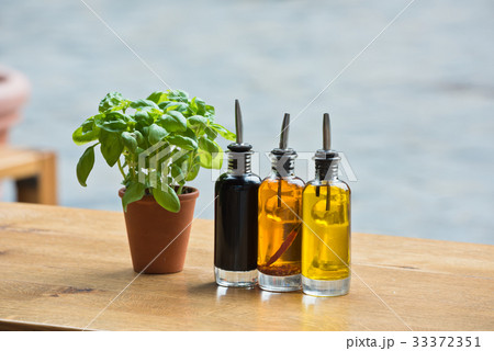 Cafe table with herbs and condiments 33372351
