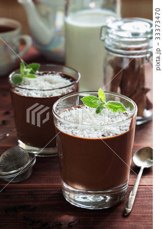Chocolate mousse in glasses with coconut and mint 33373470
