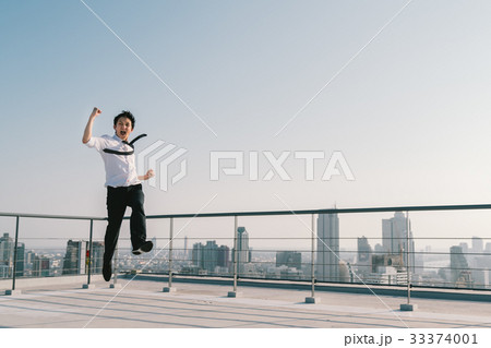 Asian businessman jumping celebrate success pose 33374001