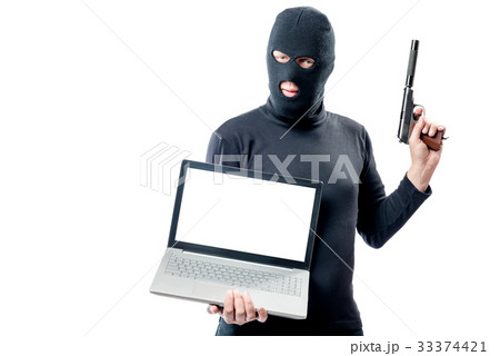 The criminal with the weapon holds a laptop The criminal with the weapon holds a laptop 33374421