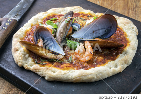 Seafood Pizza on Metal Sheet 33375193