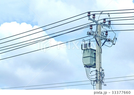Transformers are on the daylight pole. 33377660