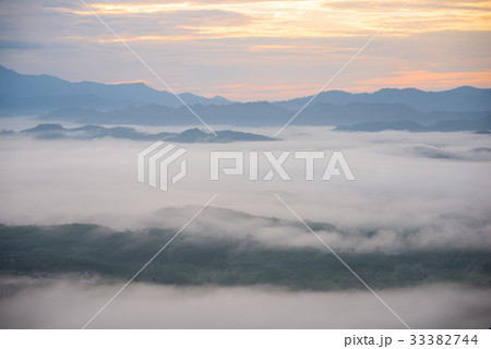 Landscape of misty mountain forest covered hills  33382744
