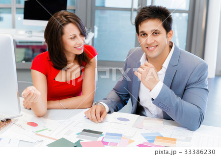 Two young business collegue in office Two young business collegue in office 33386230
