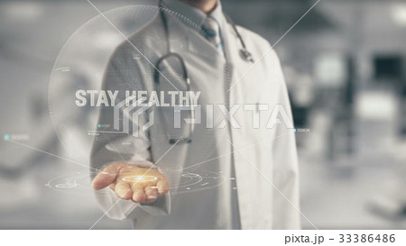 Doctor holding in hand Stay Healthy Doctor holding in hand Stay Healthy 33386486