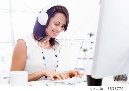 Woman in headphones Woman in headphones 33387704
