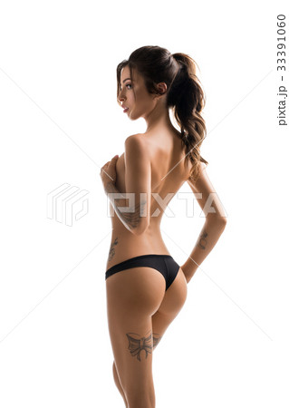 Slim tattooed girl topless rearview shot 33391060