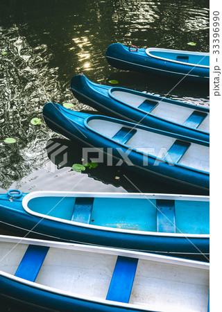 Canoe boats waiting for tourist hire on the lake 33396990