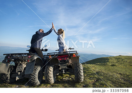 Beautiful couple is watching the sunset from the Beautiful couple is watching the sunset from the 33397098