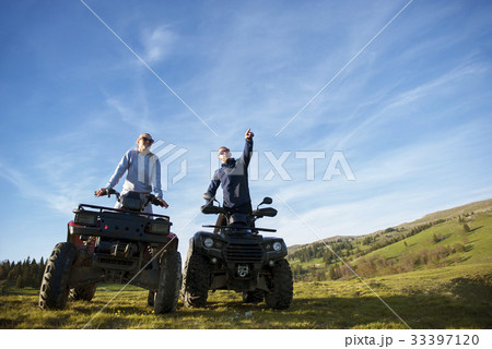Beautiful couple is watching the sunset from the 33397120
