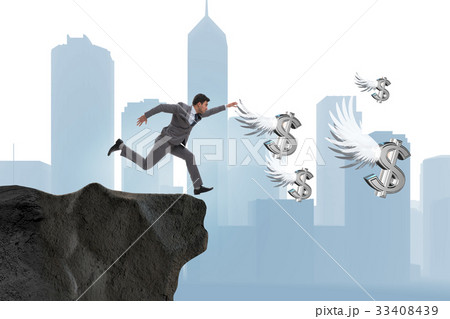 Businessman chasing angel dollars in business 33408439