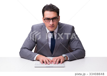Young businessman typing on a keyboard isolated on Young businessman typing on a keyboard isolated on 33408648