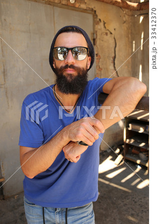 Man standing near the parallel bars 33412370