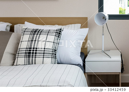 bed and pillows with white lamp on table bed and pillows with white lamp on table 33412459