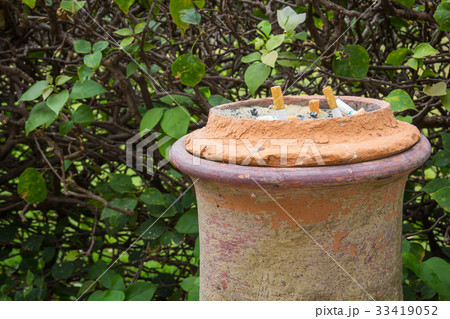 Smoked cigarettes in a dirty ashtray 33419052
