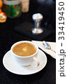 Creammy coffe in white cup with dark background 33419450