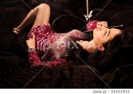 Beautiful woman lying on a soft surface with Beautiful woman lying on a soft surface with 33422933