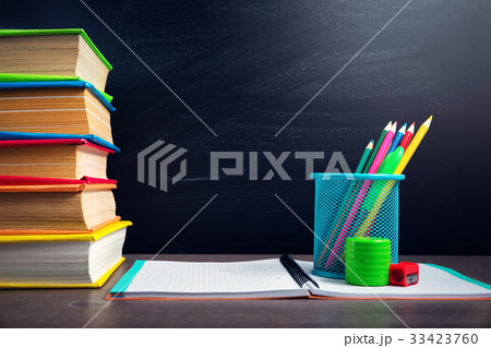 school accessories on the table with blackboard school accessories on the table with blackboard 33423760