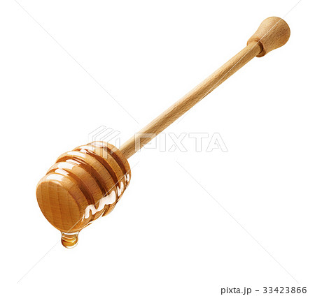Isolated wooden dipper with dripping honey Isolated wooden dipper with dripping honey 33423866