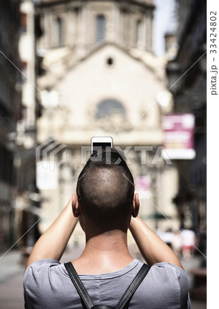 man taking a photo of the Pilar in Zaragoza, Spain 33424802