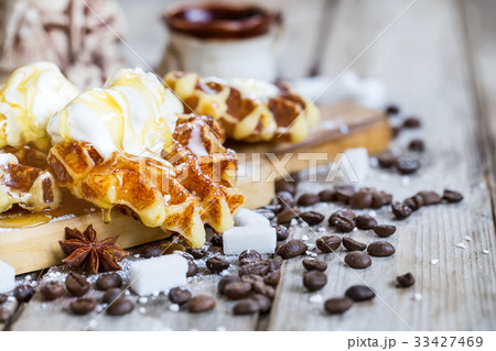 Waffers with ice cream and honey background 33427469