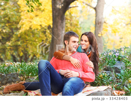 Portrait of couple enjoying golden autumn season 33428403