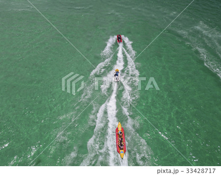 Tourists enjoying ride a banana boat 33428717