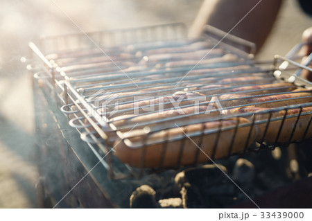 closeup shot of preparing sausages on bbq outdoors 33439000