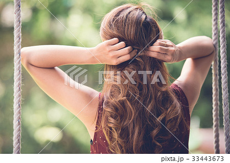 Adjusting hair 33443673