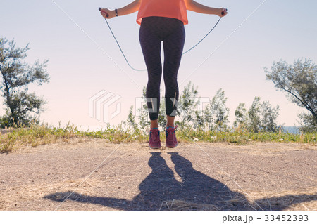 Girl in sportswear and sneakers jumping 33452393