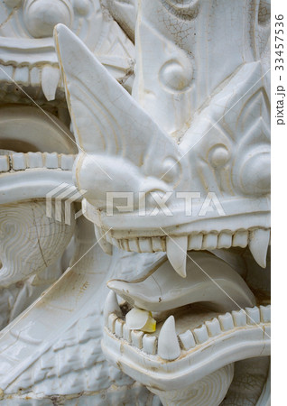 Fragment of white ceramic naga snake statue Fragment of white ceramic naga snake statue 33457536