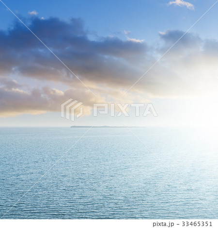 aerial view to blue sea and sunset in clouds 33465351