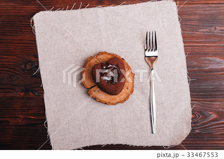 Top view of a chocolate dessert and fork 33467553