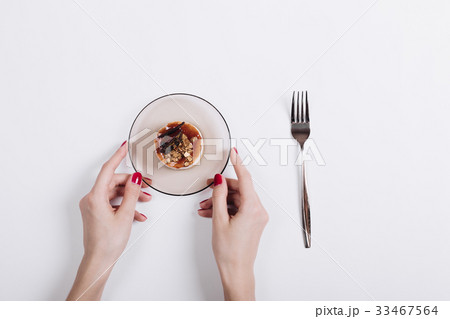 Female hands with red manicure 33467564