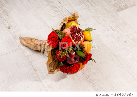Beautiful bouquet of roses and fruits. Beautiful bouquet of roses and fruits. 33467937