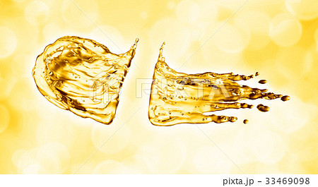 oil splash on gold bokeh background 33469098