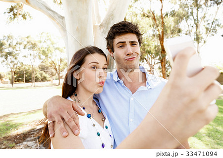 Young couple in the park Young couple in the park 33471094