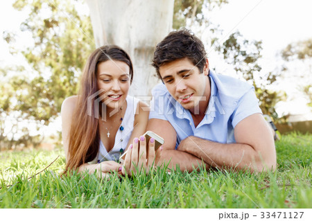 Young couple in the park Young couple in the park 33471127