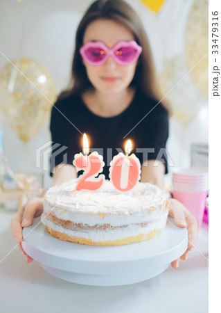 Young woman girl with cake isolated on white 33479316