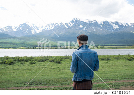 Man controling a drone on landscape background  33481614