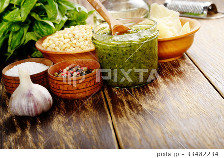 Pesto sauce ingredients and utensils on wood table 33482234