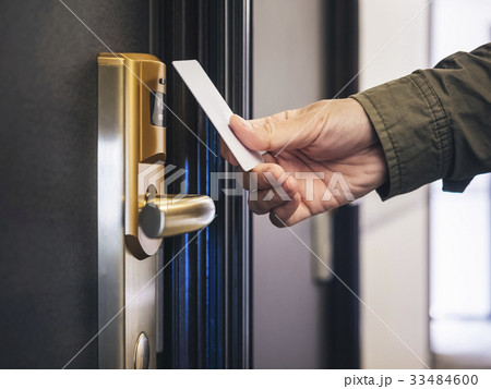 Hand Holding Key card Hotel room access Hand Holding Key card Hotel room access 33484600