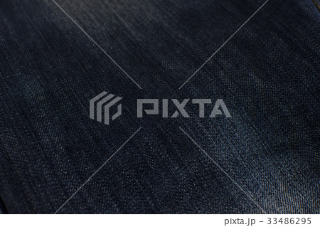 Texture of jeans dark close up, background. 33486295