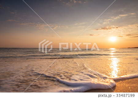 Beautiful tropical sunrise on the beach Beautiful tropical sunrise on the beach 33487199