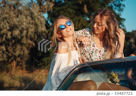 Two girls have fun in the countryside Two girls have fun in the countryside 33487721