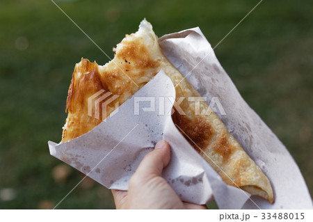 Eating banitsa outdoors Eating banitsa outdoors 33488015