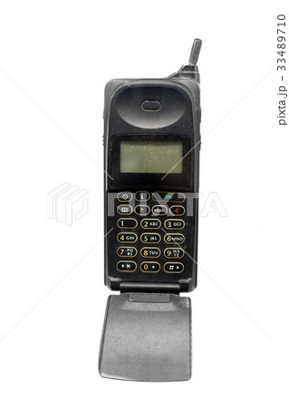 Old phone against white isolated background Old phone against white isolated background 33489710