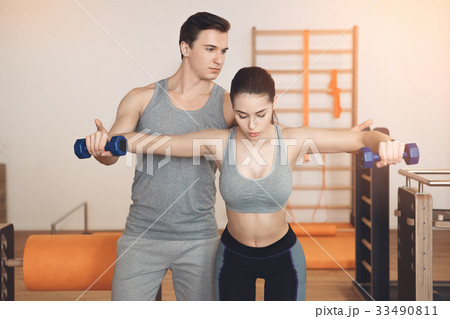 Young people training in gym body fit care 33490811