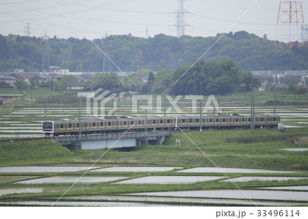 田園地帯を行く総武本線209系2000番台 33496114