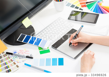 Graphic designer at work. Color samples. 33496926